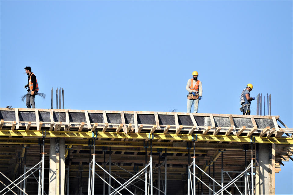 Construction workers are seen at the top of a building under construction during their weekend shifts in Ankara on April 22, 2018. Turkey prepares to go to the polls for the early presidential and parliamentary elections on June 24. ( Altan Gocher / NurPhoto via Getty Images file)