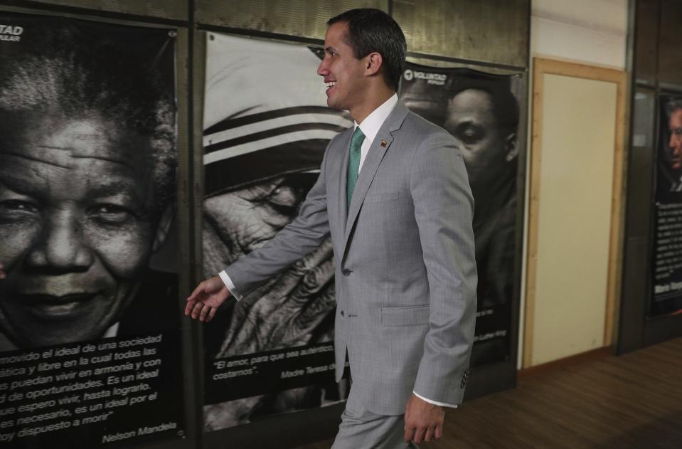 Venezuela's opposition leader Juan Guaidó, who declared himself the interim-president of Venezuela, arrives at the Popular Will party's headquarters for an interview with the Associated Press, in Caracas, Venezuela, Friday, May 10, 2019. Guaidó said he is very grateful for support from the U.S., which has slapped severe financial sanctions on Venezuela and sent planeloads of humanitarian aid to Guaidó for delivery. (AP Photo/Martin Mejia)