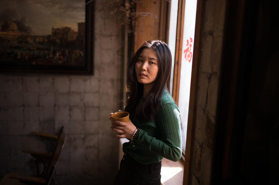 Li Yizhe turned to the energy boost of coffee to keep up with China's competitive work culture. (Fred Dufour / NBC News)