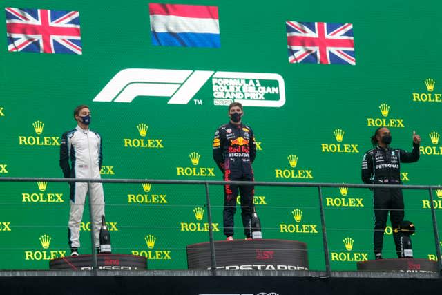 Max Verstappen topped the podium ahead of George Russell, left, and Lewis Hamilton, right (Francisco Seco/PA)