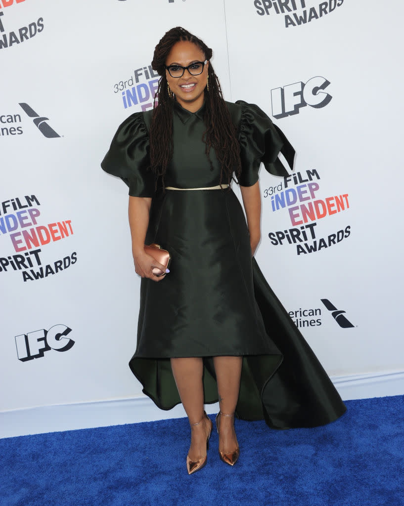 <p>The <em>Wrinkle in Time</em> director embraced volume in the sleeves and skirt of her dramatic black dress, which she accesorized with rose gold heels, belt, and clutch. (Photo: Getty Images) </p>