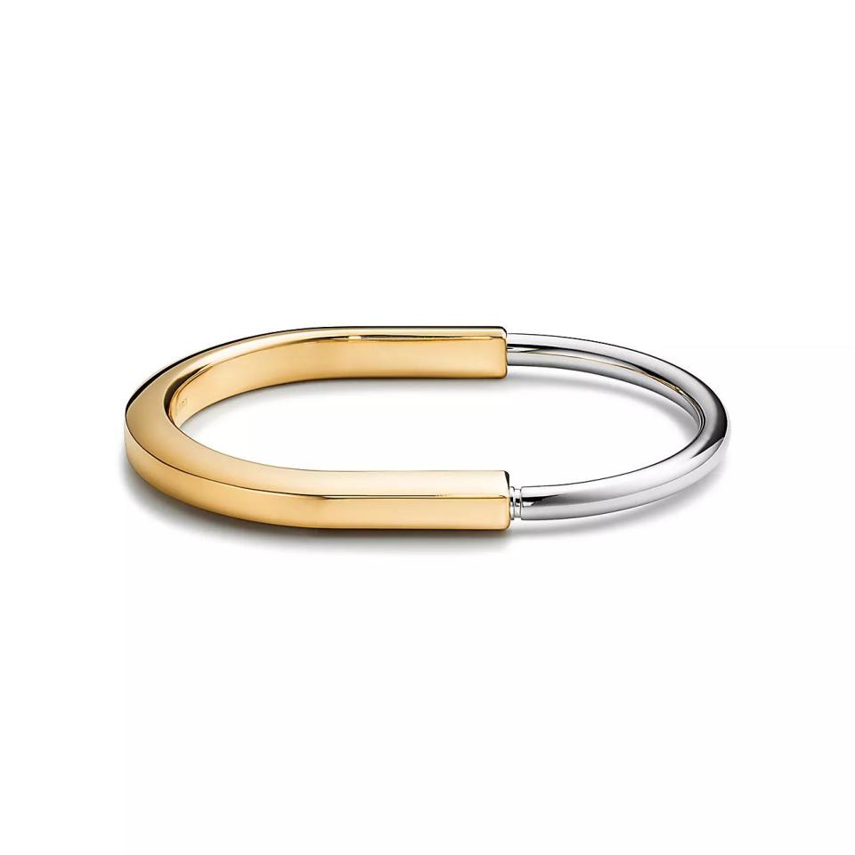 <p><a href="https://www.tiffany.com/jewelry/bracelets/tiffany-lock-bangle-GRP12330/" rel="nofollow noopener" target="_blank" data-ylk="slk:Shop Now;elm:context_link;itc:0;sec:content-canvas" class="link ">Shop Now</a></p><p>Lock Bangle in Yellow and White Gold</p><p>tiffany.com</p><p>$7500.00</p><span class="copyright">Tiffany & Co.</span>