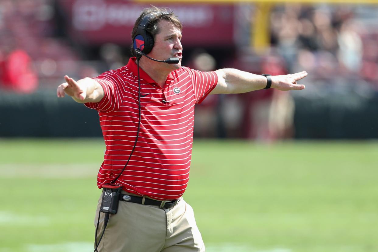 Georgia co-defensive coordinator Will Muschamp signals to the defense during a college football game against South Carolina on Saturday, Sept. 17, 2022 in Columbia, S.C. Georgia won 48-7. (AP Photo/Artie Walker Jr.)