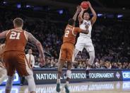 Apr 2, 2019; New York, NY, USA; Texas Christian Horned Frogs guard Desmond Bane (1) shoots the ball against the Texas Longhorns in the first half of the NIT semifinals at Madison Square Garden. Mandatory Credit: Wendell Cruz-USA TODAY Sports