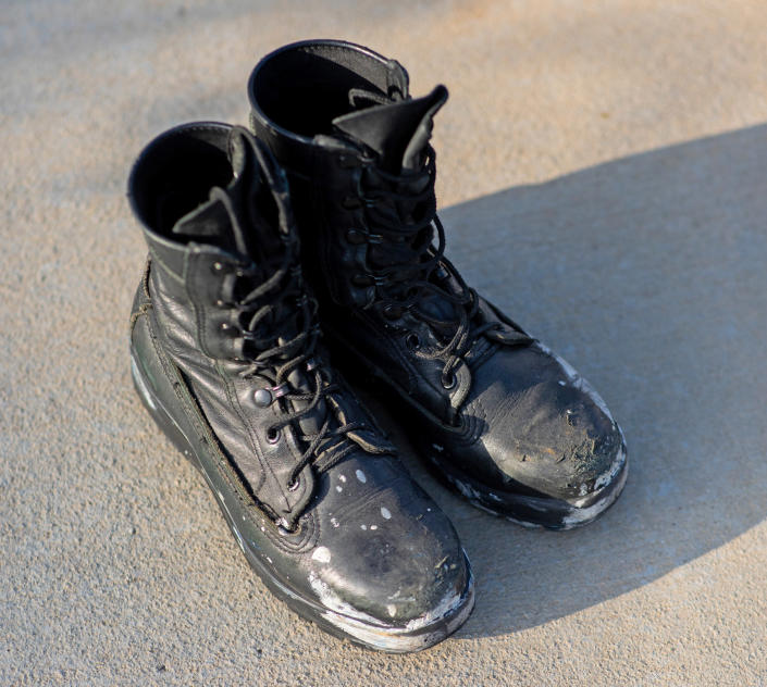 Hannah Crisostomo's boots from her time in the U.S. Navy. (Alex Welsh for NBC News)