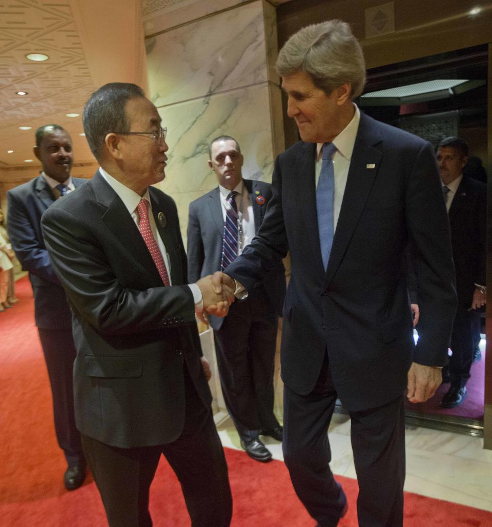 U.S. Secretary of State John Kerry, right, is greeted by UN Secretary General Ban Ki-Moon, left, before the start of their meeting at Bayan Palace in Kuwait City, Kuwait, Wednesday, Jan. 15, 2014. (AP Photo/Pablo Martinez Monsivais, Pool)