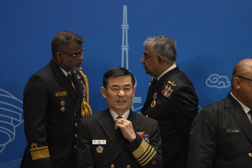 A South Korea's military representative prepares for a group photo before attending the Western Pacific Navy Symposium in Qingdao, eastern China's Shandong province on Monday, April 22, 2024. The meeting has drawn representatives from partners and competitors including Australia, Cambodia, Chile, France, India and the U.S. and comes amid heightened tensions over China's assertive actions in the Taiwan Strait and the East and South China seas, and as China's navy has grown into the world's largest by number of hulls. (AP Photo/Ng Han Guan)