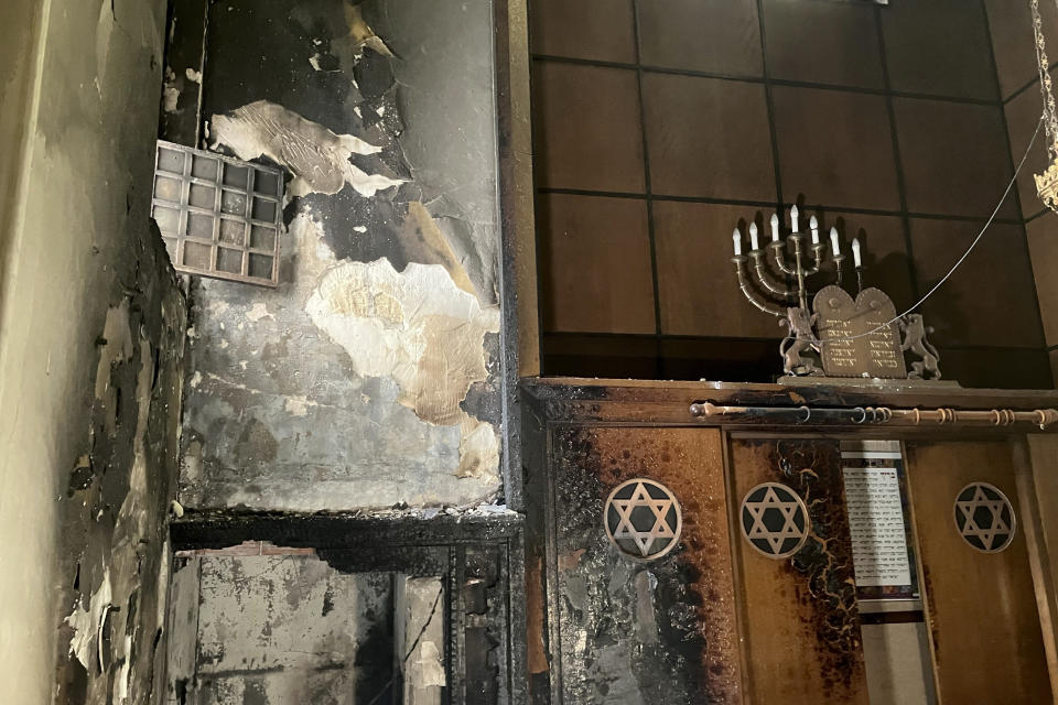 A view of the synagogue where a man armed with a knife and a metal bar is suspected of having set fire, Friday, May 17, 2024 in Rouen, France. French police have shot and killed a man armed with a knife and a metal bar who is suspected of having set fire to a synagogue in the Normandy city of Rouen. French police said officers were alerted early Friday morning that smoke was rising from the synagogue and came face to face with the man when they got there.(AP Photo/Oleg Cetinic)