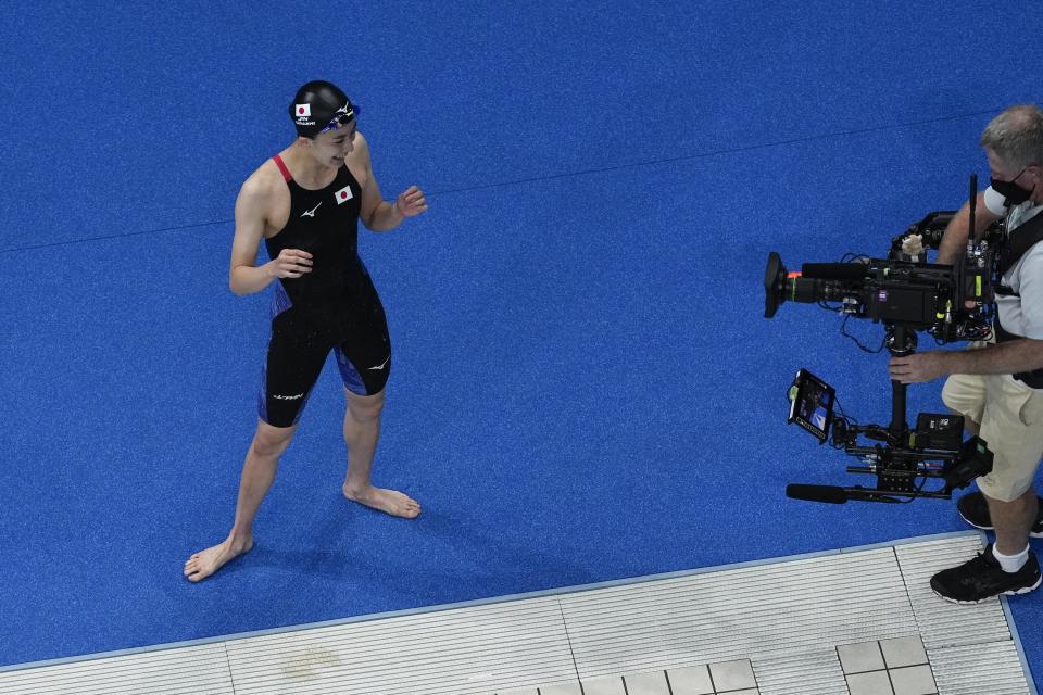 Yui Ohashi, of Japan, reacts after winning the women's 200-meter individual medley final at the 2020 Summer Olympics, Wednesday, July 28, 2021, in Tokyo, Japan. (AP Photo/Morry Gash)