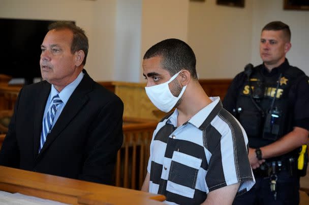 PHOTO: Hadi Matar, 24, center, listens to his public defense attorney Nathaniel Barone, left, addresses the judge while being arraigned in the Chautauqua County Courthouse in Mayville, New York, on Aug. 13, 2022. (Gene J. Puskar/AP Photo)