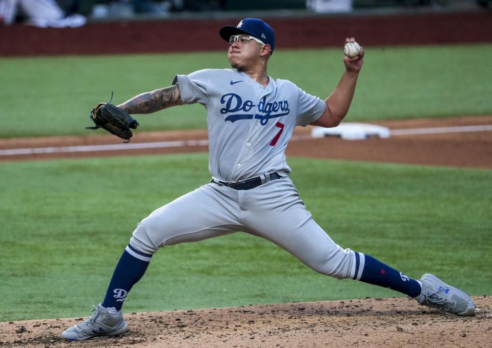 Julio Urias, on the mound, prepares to deliver a pitch.