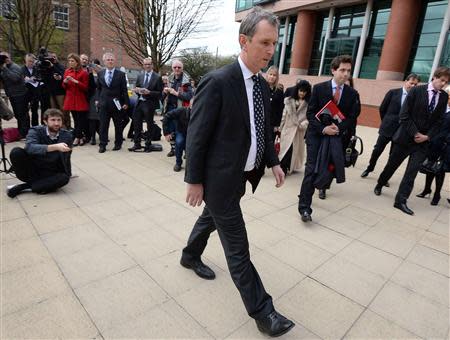 Former deputy speaker of the House of Commons Nigel Evans leaves after speaking to the media outside Preston Crown Court, northern England April 10, 2014. REUTERS/Nigel Roddis