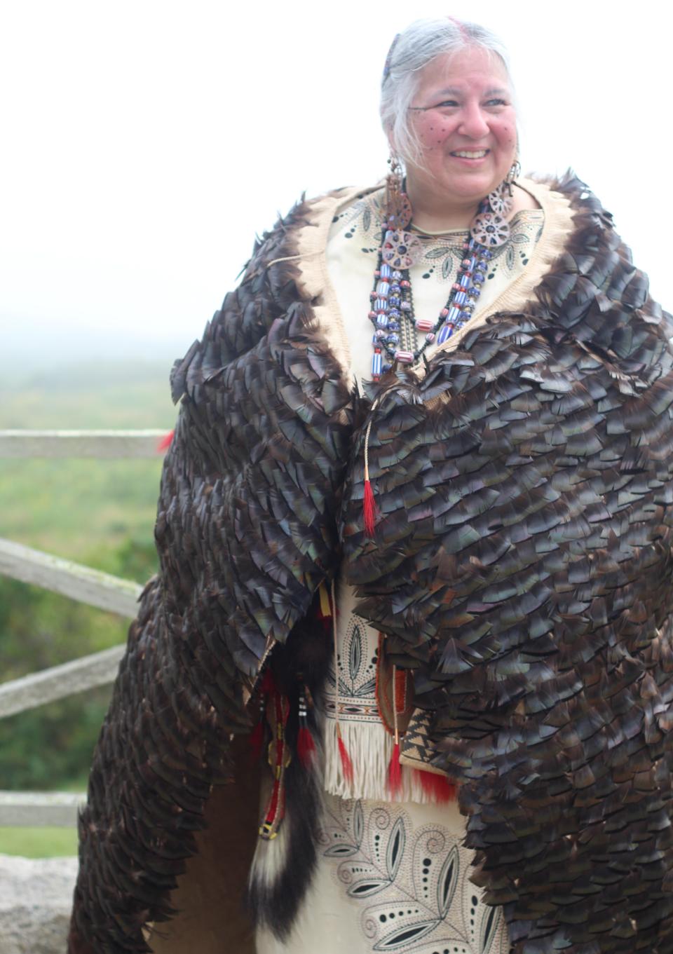 It took about a year for Julia Marden, a member of the Wampanoag Tribe Gay Head (Aquinnah) to twine a turkey feather mantle, which she revealed Sunday during the Aquinnah Wampanoag Powwow. The cape-like garment is the first of its kind on the East Coast in 400 years.
