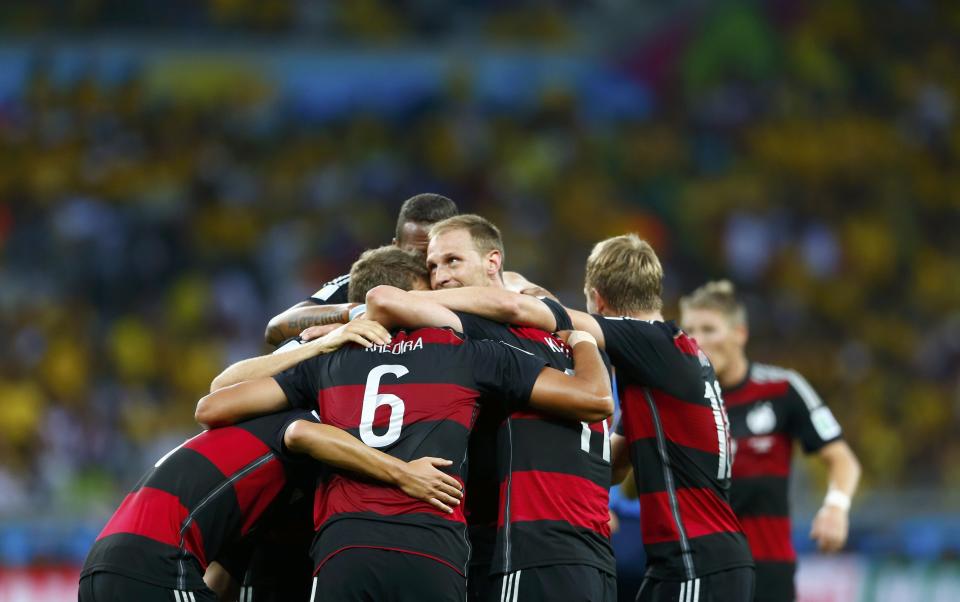 Germany's Sami Khedira (6) celebrates teammates after scoring a goal during the 2014 World Cup semi-finals between Brazil and Germany at the Mineirao stadium in Belo Horizonte July 8, 2014. REUTERS/Eddie Keogh