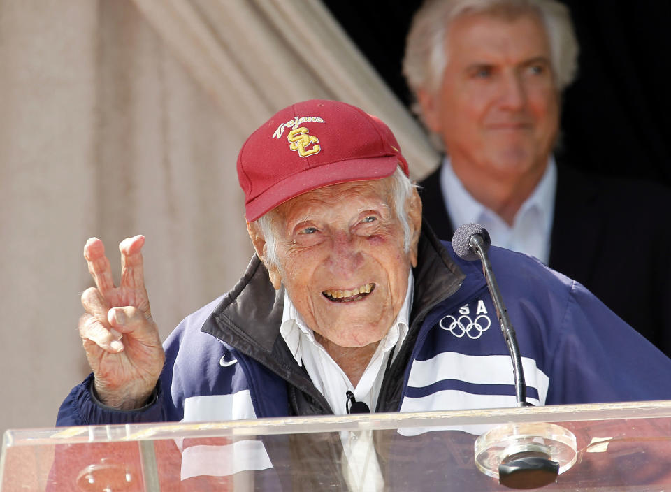 Louis Zamperini gestures during a news conference Friday May 9, 2014 in Pasadena, Calif. Ninety-seven-year-old World War II hero and former Olympian, Zamperini has been named grand marshal of the 2015 Rose Parade.(AP Photo/Nick Ut)