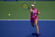 Marta Kostyuk, of the Ukraine, returns a shot to Naomi Osaka, of Japan, during the third round of the US Open tennis championships, Friday, Sept. 4, 2020, in New York. (AP Photo/Seth Wenig)