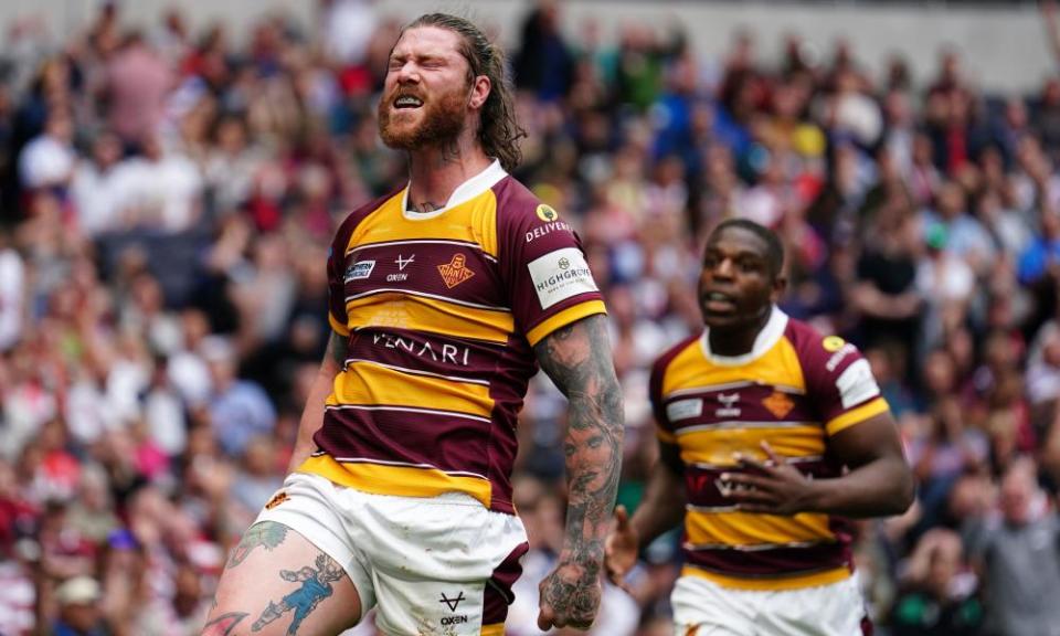 Huddersfield’s Chris McQueen celebrates scoring his first-half try at the Tottenham Hotspur Stadium.