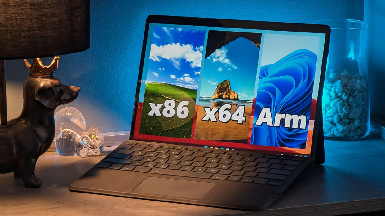  Microsoft Surface Pro X with third-party keyboard showing x86, x64, and Arm icons. 