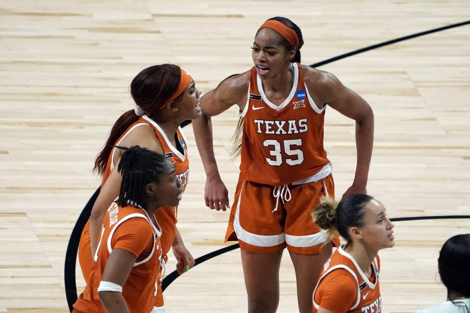 Texas forward Charli Collier (35) and forward Lauren Ebo (1) react in the fourth quarter during their Sweet 16 game against Maryland.