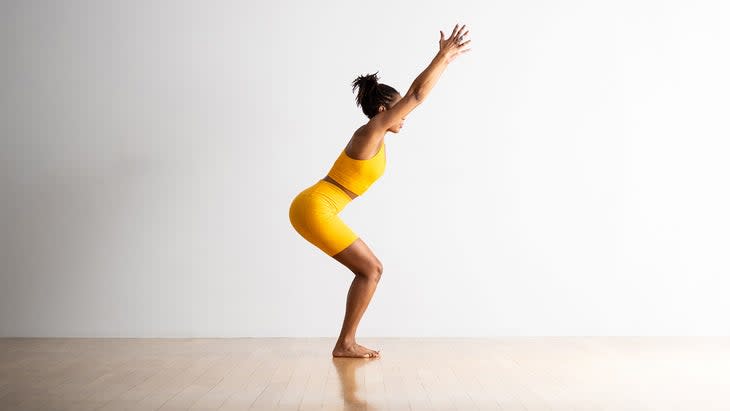 Woman demonstrating Chair pose