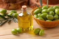 <p>Extra virgin olive oil (EVOO) has been a culinary staple for more reasons than it’s plain delicious. It’s proven to help reduce inflammation, <a href="https://www.prevention.com/health/health-conditions/g26576559/foods-for-high-blood-pressure/" rel="nofollow noopener" target="_blank" data-ylk="slk:lower blood pressure;elm:context_link;itc:0;sec:content-canvas" class="link ">lower blood pressure</a>, and improve insulin sensitivity, Dixon says. </p><p>“Extra virgin olive oil has an excellent record of research demonstrating benefits to the cardiovascular system, which is particularly important to note these days, given the fact that <a href="https://www.prevention.com/health/a20516946/surprising-heart-attack-risk/" rel="nofollow noopener" target="_blank" data-ylk="slk:heart disease;elm:context_link;itc:0;sec:content-canvas" class="link ">heart disease</a> is the number one killer in the U.S.,” says Dixon. </p><p>Make a <a href="https://www.prevention.com/food-nutrition/recipes/g26822167/whole30-salad-dressing-recipes/" rel="nofollow noopener" target="_blank" data-ylk="slk:homemade salad dressing;elm:context_link;itc:0;sec:content-canvas" class="link ">homemade salad dressing</a> with EVOO, drizzle some over veggies before roasting them to get them nice and crisp, and sub it in for butter in recipes to reduce saturated fat.</p>