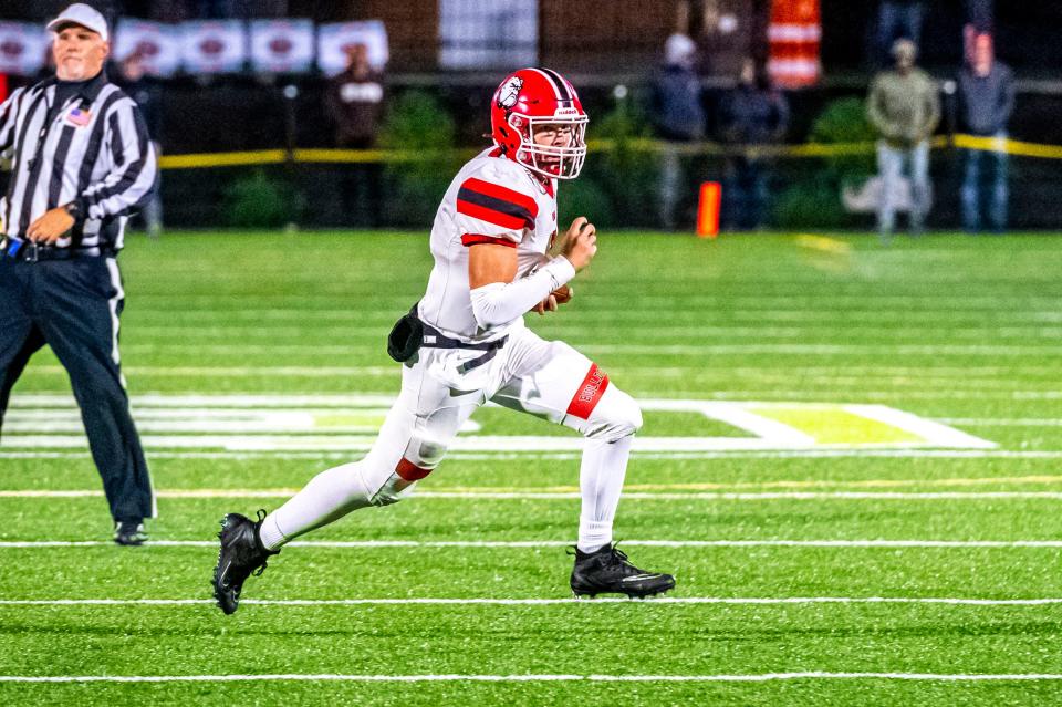 Old Rochester's Noah Sommers scrambles from the pocket.