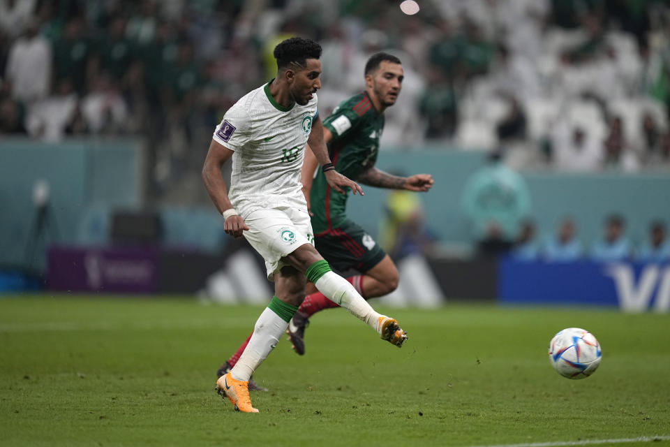 Saudi Arabia's Salem Al-Dawsari scores his side's first goal during the World Cup group C soccer match between Saudi Arabia and Mexico, at the Lusail Stadium in Lusail, Qatar, Wednesday, Nov. 30, 2022. (AP Photo/Ebrahim Noroozi)