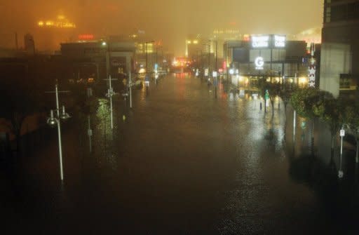 A flooded street is seen at nightfall during rains from Hurricane Sandy in Atlantic City