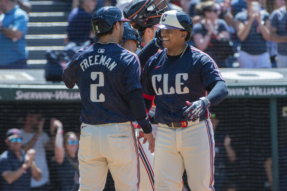 Cleveland Guardians' Tyler Freeman (2) congratulates Bo Naylor after his three-run home run off San Francisco Giants relief pitcher Sean Hjelle during the sixth inning of a baseball game in Cleveland, Sunday, July 7, 2024. (AP Photo/Phil Long)