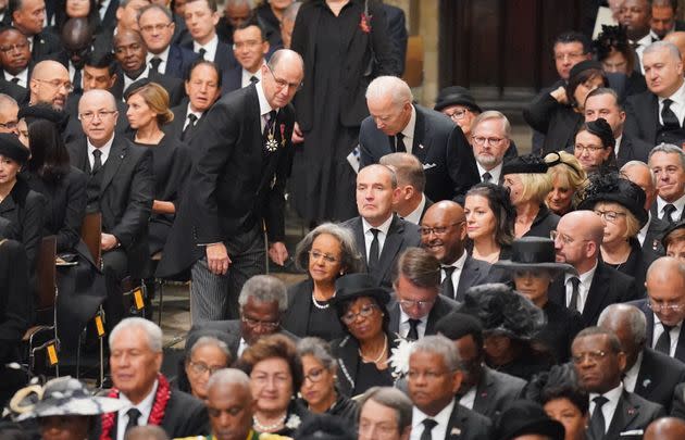 Joe Biden takes his seat several minutes late at Westminster Abbey. (Photo: WPA Pool via Getty Images)