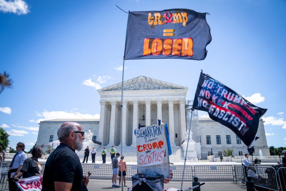 Protesters demonstrate outside of the Supreme Court on July 1. The Supreme Court granted Donald Trump some immunity from criminal prosecution on Monday (AP)