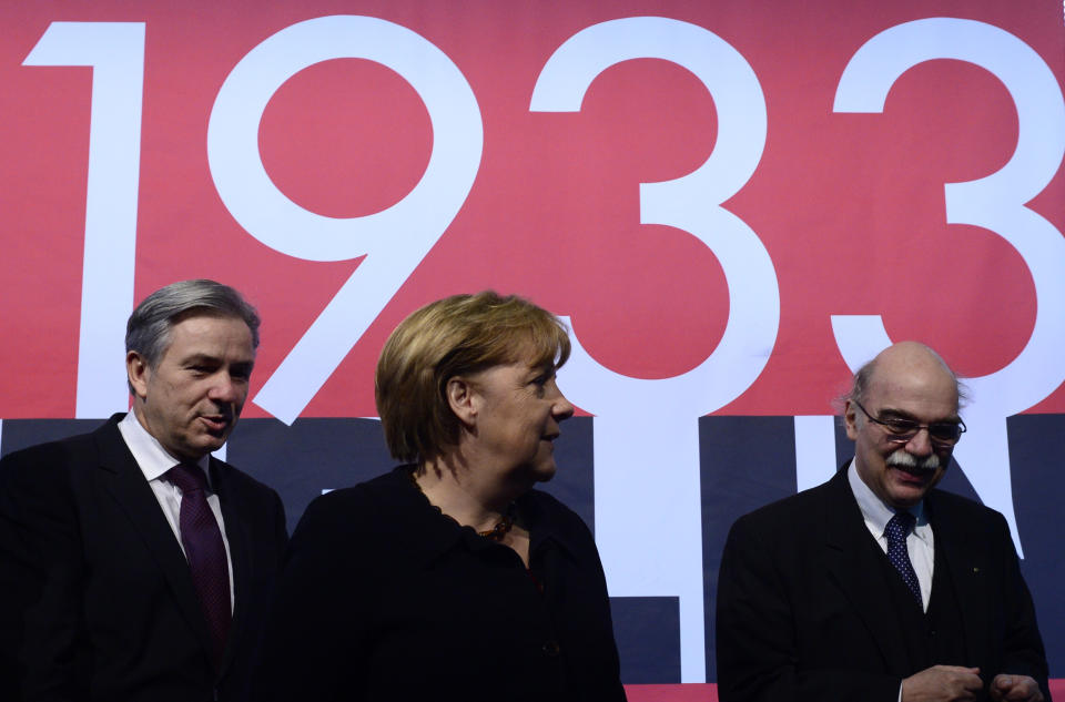 (L-R) Berlin's mayor Klaus Wowereit, German Chancellor Angela Merkel, Professor Andreas Nachama, managing director of 'Topographie des Terrors' inaugurate the exhibition  'Berlin 1933 On the Path to Dictatorship', tracing Adolf Hitler's rise to power in Germany in 1933 to mark 80 years since he became chancellor on January 30, 2013 at the open-air documentation center Topographie des Terrors in Berlin. (JOHN MACDOUGALL/AFP/Getty Images)