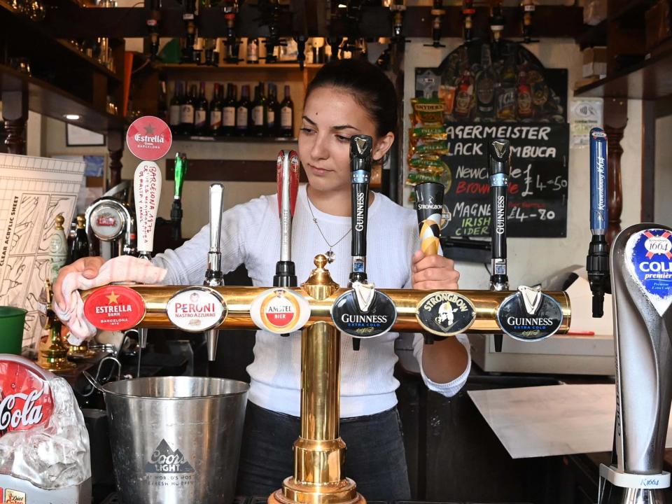 Pub staff get ready for reopening on "Super Saturday" in London's Soho district: EPA