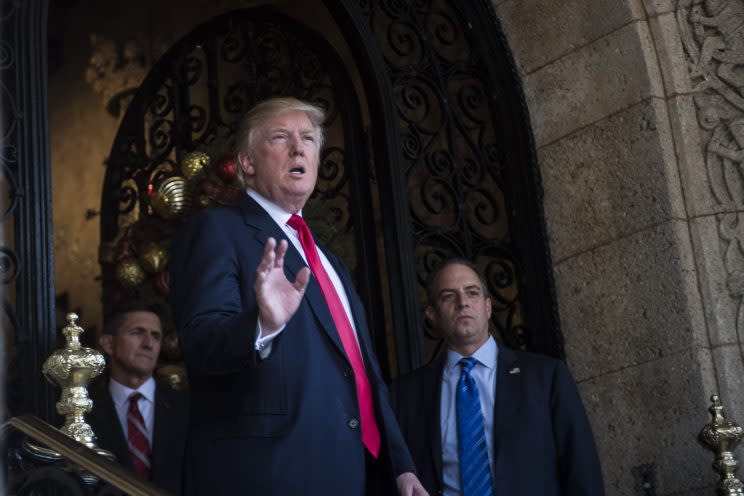 President-Elect Donald J. Trump, retired U.S. Army Lieutenant General Michael T. Flynn, and Chief of Staff Reince Priebus walk out to speak to members of the media at the Mar-a-Lago club in Palm Beach, FL on Wednesday, Dec. 21, 2016. (Photo: abin Botsford/The Washington Post via Getty Images)