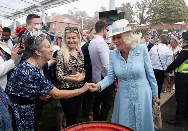 Camilla shaking hands with people at York raceourse