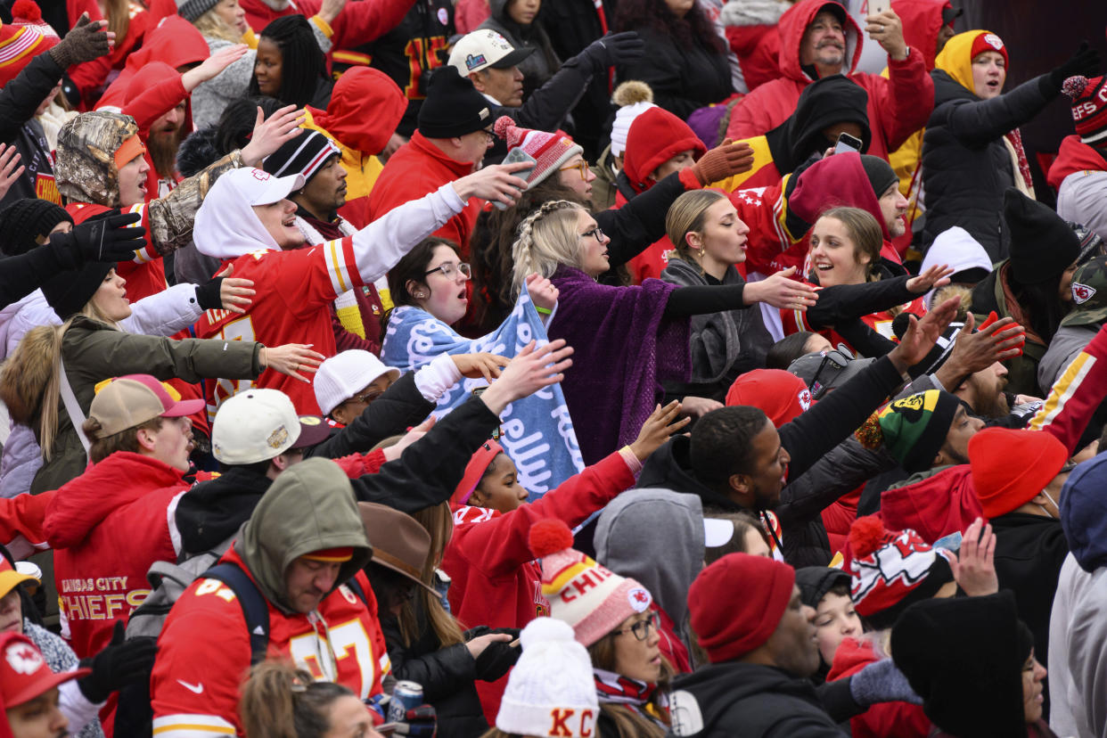 Fans do the tomahawk chop during the Kansas City Chiefs' victory celebration and parade in Kansas City, Mo., Wednesday, Feb. 15, 2023, following the Chiefs' win over the Philadelphia Eagles Sunday in the NFL Super Bowl 57 football game. (AP Photo/Reed Hoffmann)