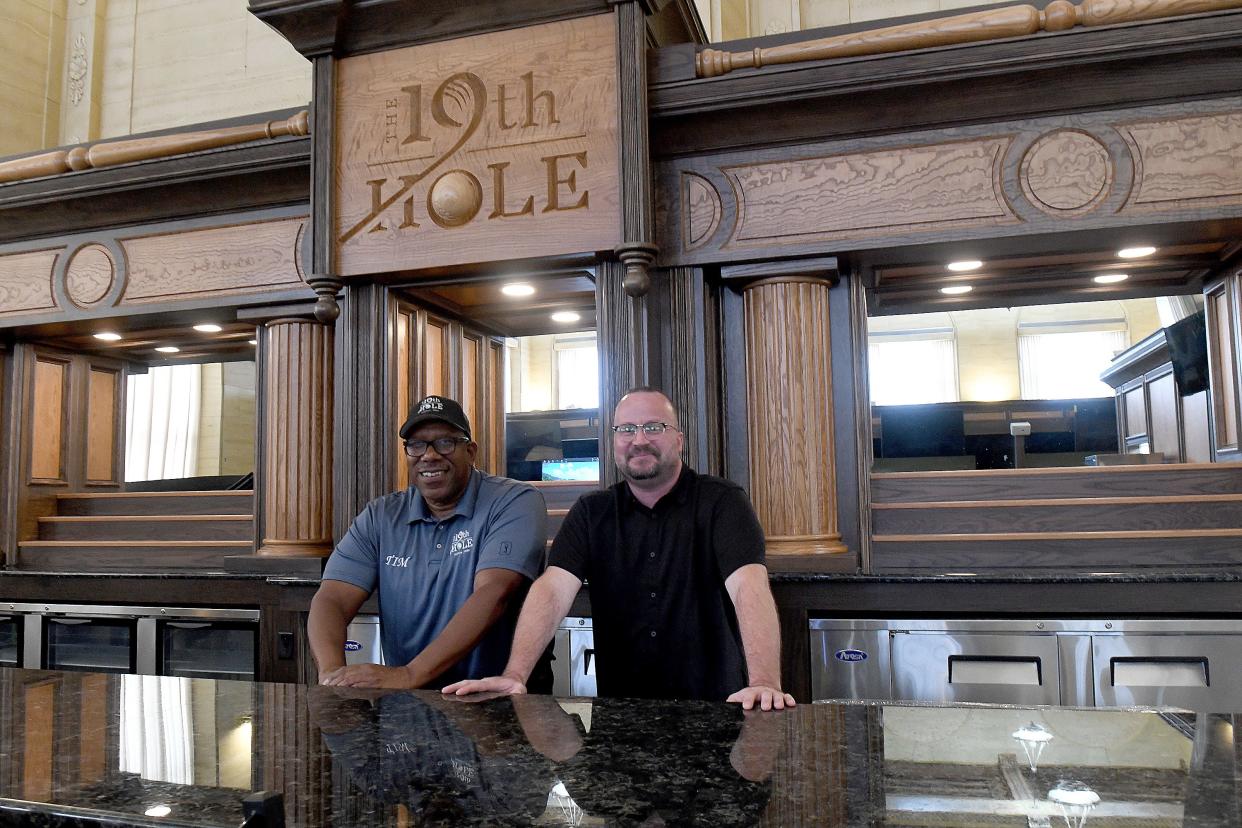 Timothy Gillems and Jared Clark are shown at The 19th Hole in downtown Canton. The business partners say The 19th Hole will feature indoor golf, food and drinks.