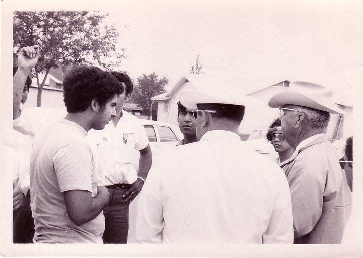 Alfredo Santos, left, one of the students who joined the Uvalde walkouts in 1970, stands with Texas Rangers Capt. A.Y. Alle, right, and Texas Ranger Arturo Rodriguez.