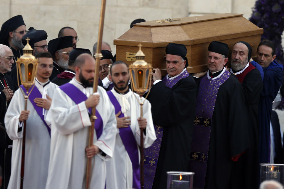Clergymen carry the coffin of former Maronite Patriarch Cardinal Mar Nasrallah Boutros Sfeir, during his funeral Mass, at the seat of the Maronite Church, in the village of Bkirki, north of Beirut, Lebanon, Thursday, May 16, 2019. Sfeir, who served as spiritual leader of Lebanon's largest Christian community through some of the worst days of the country's 1975-1990 civil war, died Sunday. (AP Photo/Bilal Hussein)