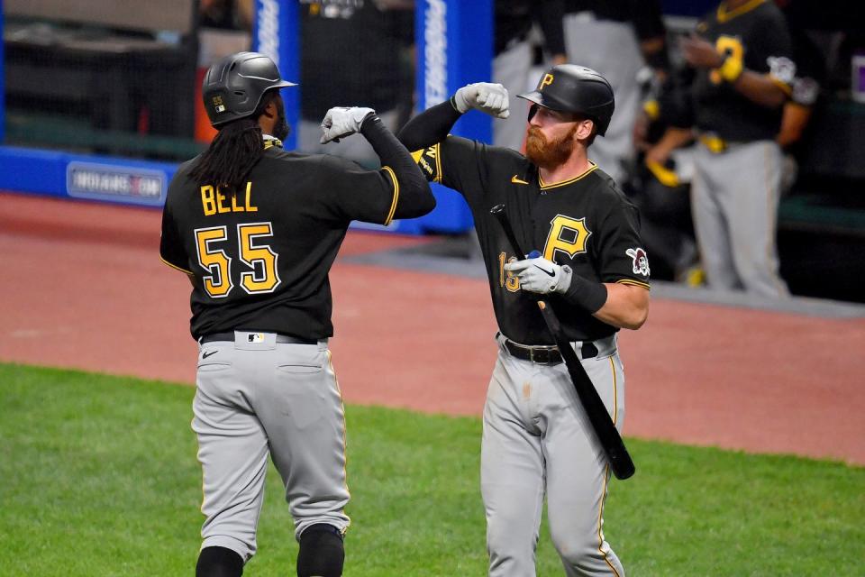 <p>Josh Bell #55 of the Pittsburgh Pirates celebrates with Colin Moran #19 after hitting a homer during the sixth inning against the Cleveland Indians at Progressive Field on July 20, 2020 in Cleveland, Ohio.</p>