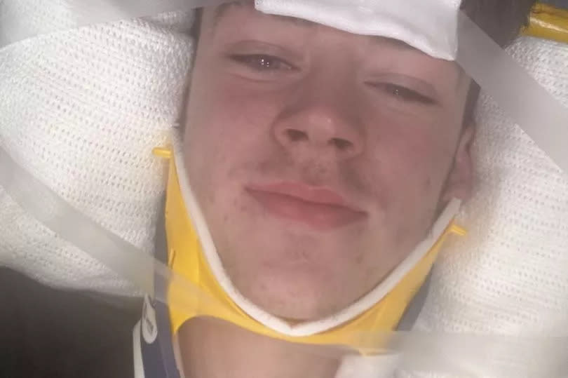 Jason in a neck brace after the crash