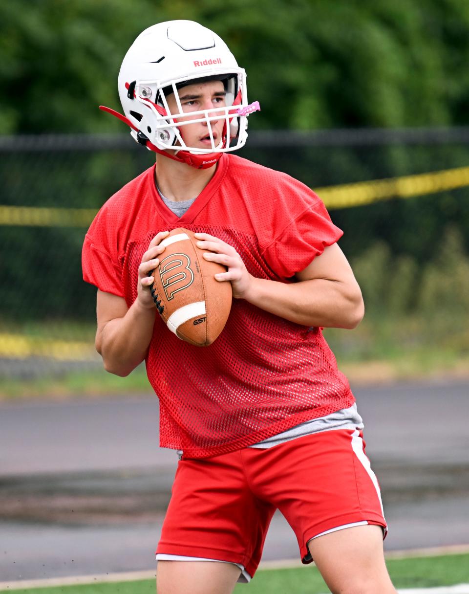 HYANNIS   08/22/22  Barnstable quarterback Jake Mooney looks to pass during a drill Monday afternoon at the school.   football