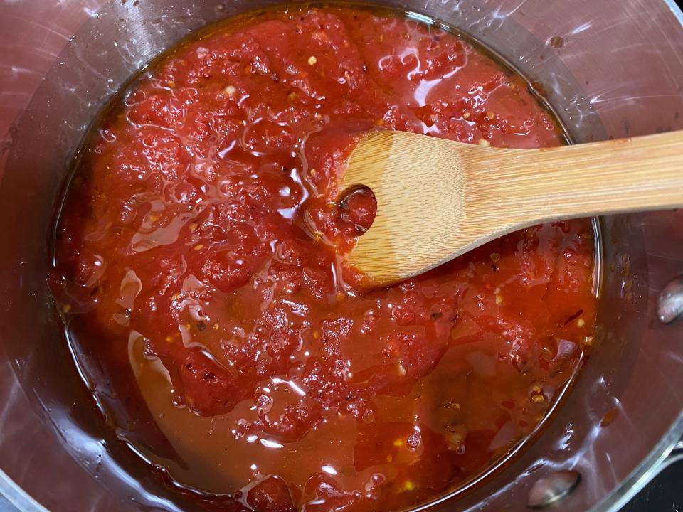 cooking 5 minute marinara sauce in metal pot