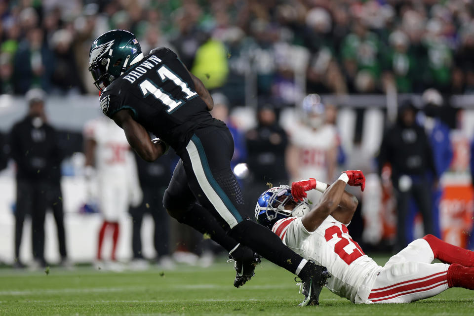 PHILADELPHIA, PENNSYLVANIA – DECEMBER 25: A.J. Brown #11 of the Philadelphia Eagles runs the ball against Adoree’ Jackson #22 of the New York Giants during the fourth quarter at Lincoln Financial Field on December 25, 2023 in Philadelphia, Pennsylvania. (Photo by Adam Hunger/Getty Images)