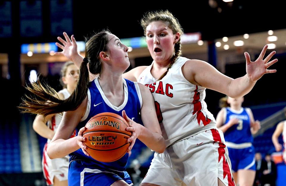 Hopedale eighth grader  Phoebe Carroll eyes the hoop during the first half of the Division 5 state championship against  Hoosac Valley at the Tsongas Center in Lowell, March 20, 2022.