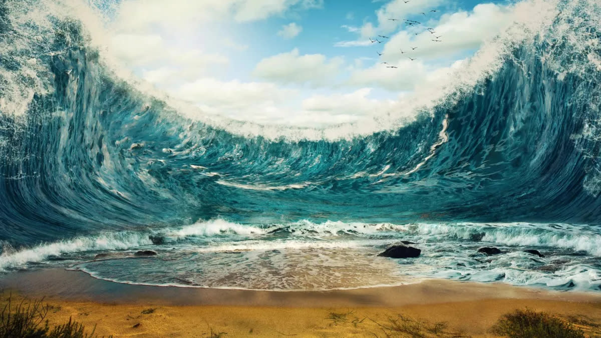  An artist's illustration of a tsunami wave poised to crash down upon a beach. 