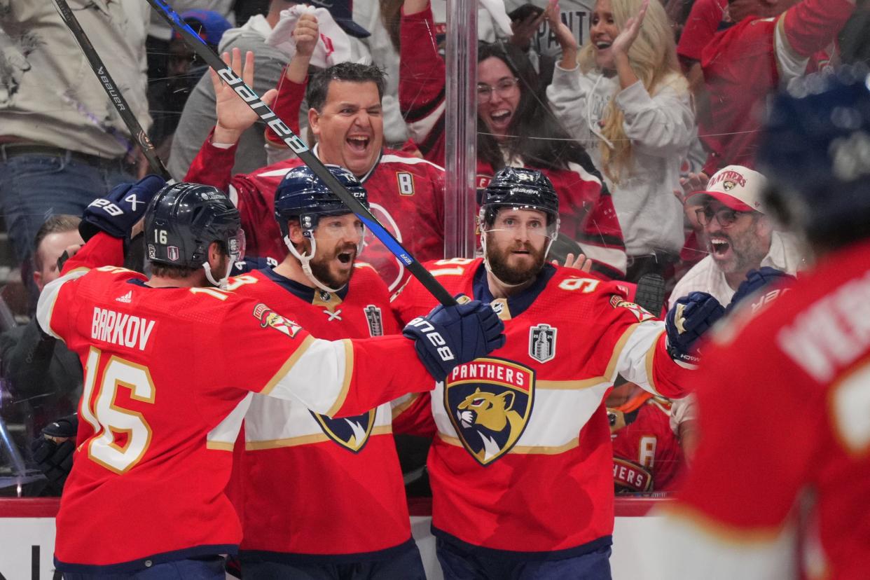 Jun 24, 2024; Sunrise, Florida, USA; Florida Panthers forward Sam Reinhart (13) celebrates scoring during the second period against the Edmonton Oilers with forward Aleksander Barkov (16) and defenseman Oliver Ekman-Larsson (91) in game seven of the 2024 Stanley Cup Final at Amerant Bank Arena. Mandatory Credit: Jim Rassol-USA TODAY Sports