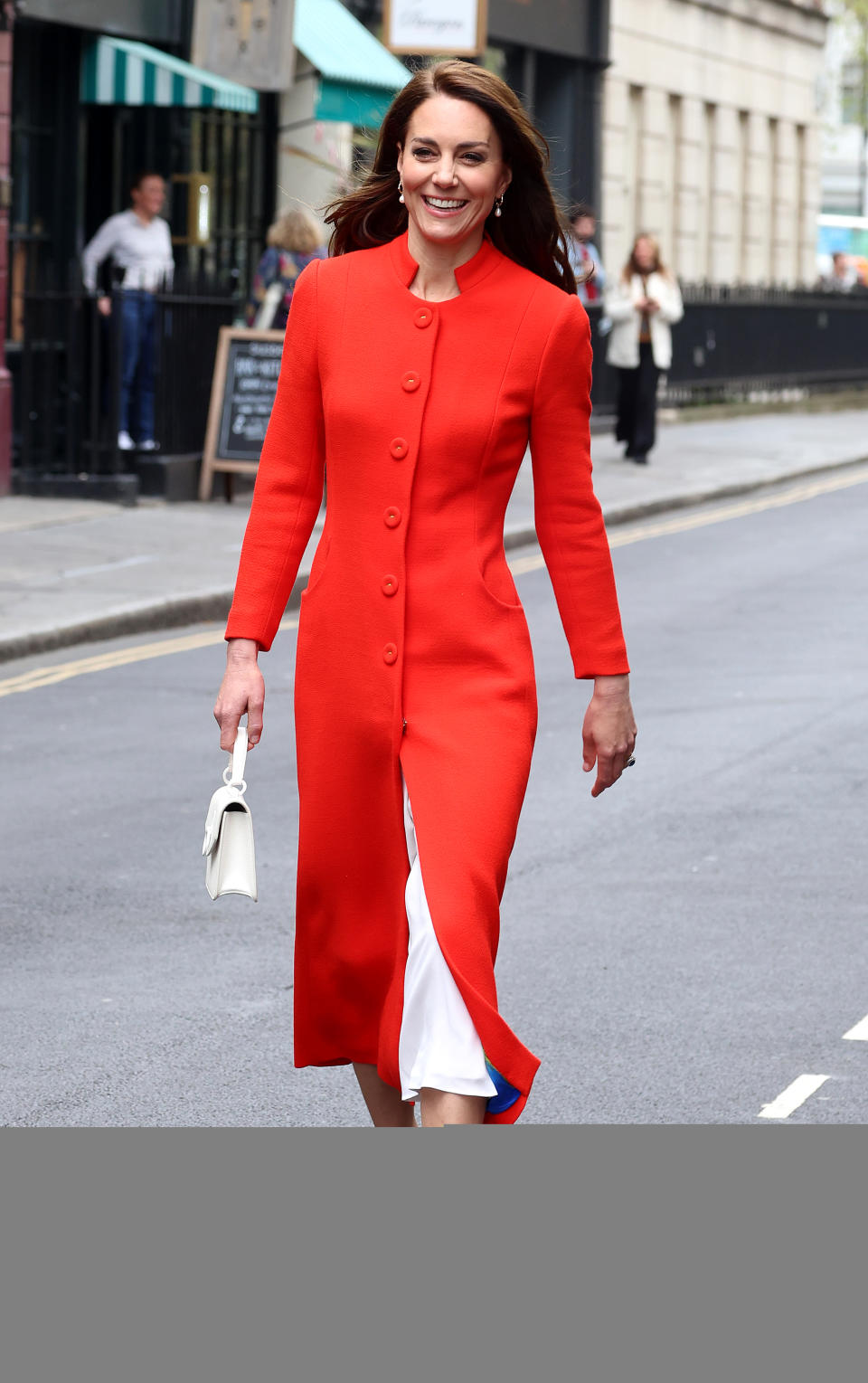 <p> Shortly before King Charles III's coronation in 2023, Kate stepped out in this pretty red Eponine London Tulip coat. It was a nice contrast with her white bag, white Jimmy Choo shoes, and white skirt or dress underneath (the buttons on the dress complemented the ones on the coat). This was their first event for the Coronation weekend, kicking off what would be a colorful and sartorially elevated weekend for Kate. </p>