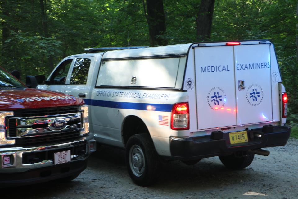 The medical examiner arrives at Lincoln Woods State Park Saturday to take custody of a kayaker who drowned.