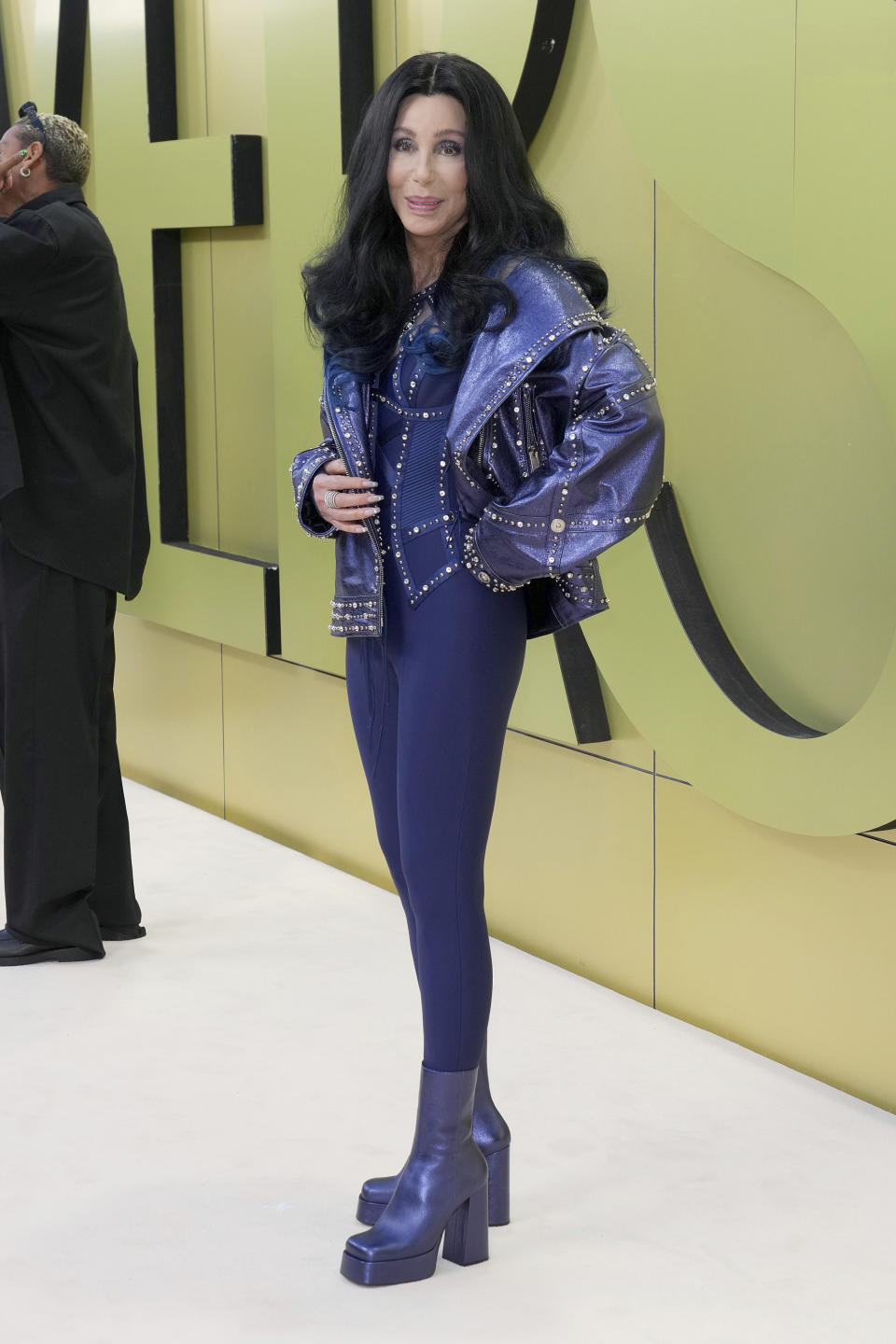 FILE - Cher arrives at the Versace Fall/Winter collection presentation on Thursday, March 9, 2023, at the Pacific Design Center in West Hollywood, Calif. Cher turns 77 on May 20.(Photo by Jordan Strauss/Invision/AP, File)